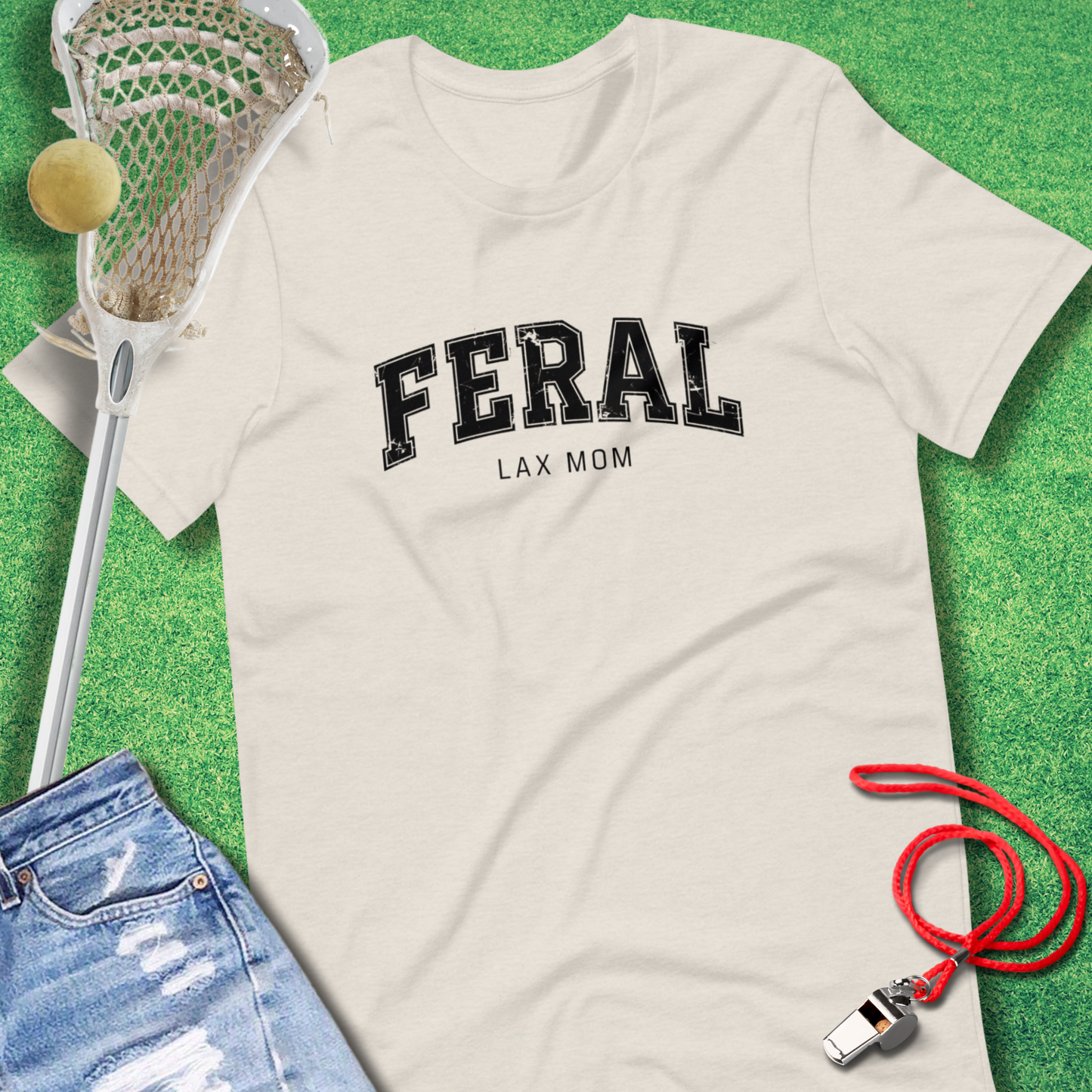 Sideline Gods lacrosse mom apparel featuring “Feral Lax Mom” slogan on a casual tee.