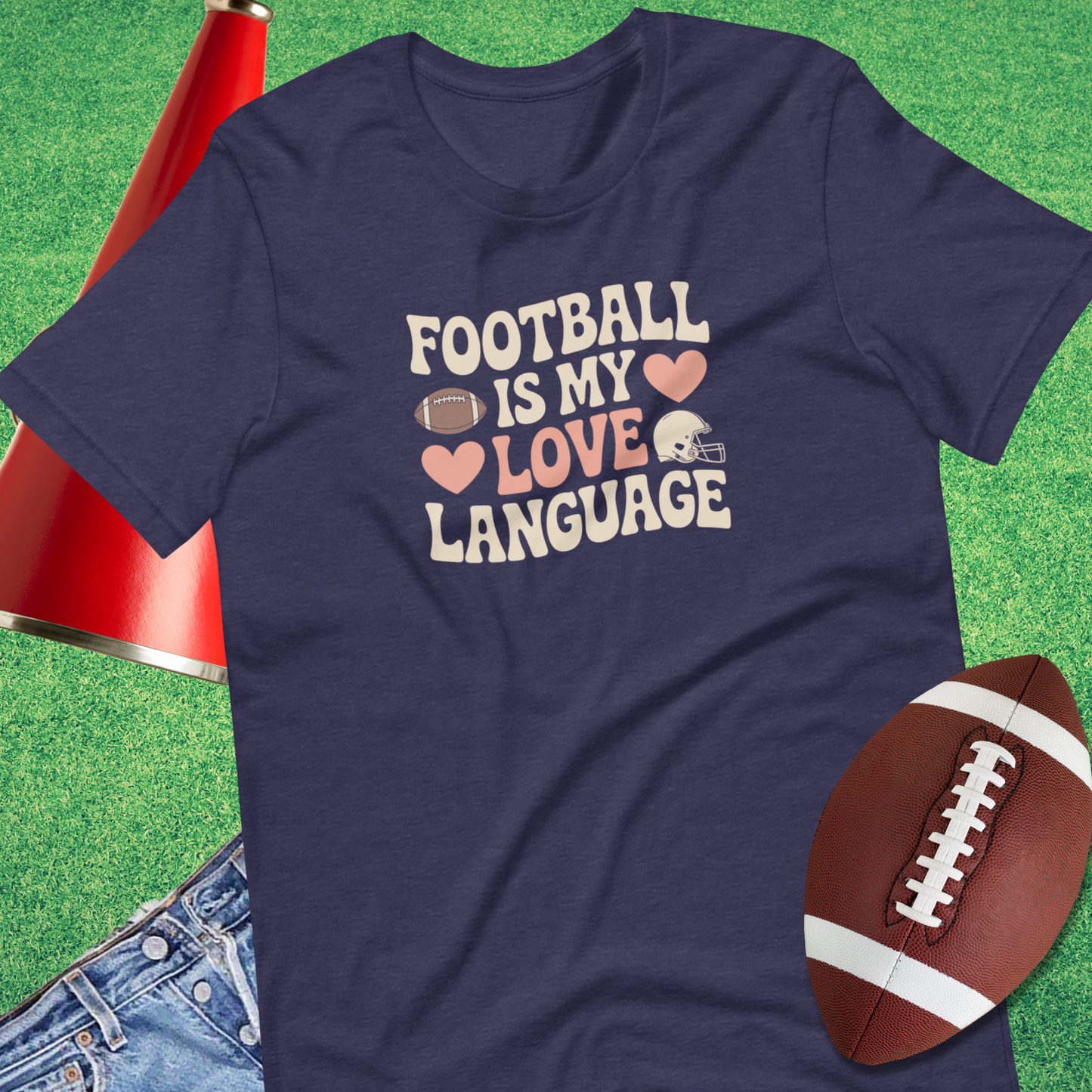 Flat lay of Sideline Gods Football Is My Love Language t-shirt with football accessories gift for football mom